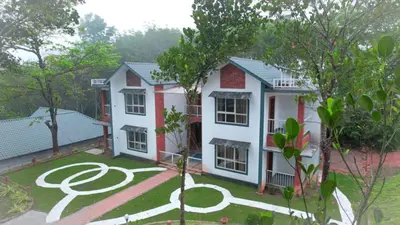 a house with a garden in front of it at Viewpointwayanad in Mananthavady