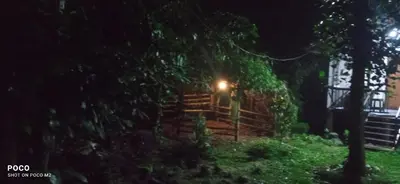 a house with a light on it at night at Family villa is a hut style accommodation in Tariyod