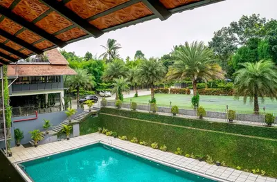 an image of a swimming pool at a resort at Fern Tree Resort in Mananthavady