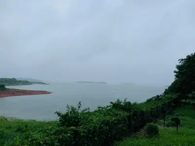 a view of a body of water from a hill at Diga vista resorts in Palakkad