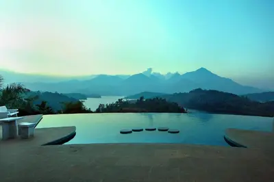 a swimming pool with a view of a mountain at Arayal Resort-A Unit of Sharoy Resort in Tariyod