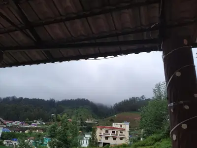 a view of a city from a building at A Ooty Honey Huts in Ooty