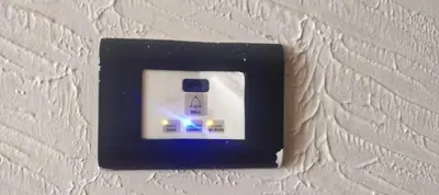 a light switch on a white wall at THE CASTELLO RESIDENCY in Coimbatore
