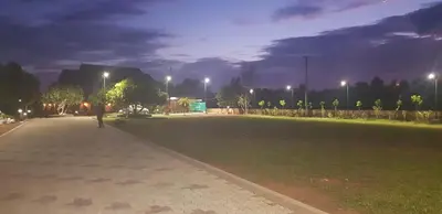 a park at night with lights on at Green Planet Resort in Mattanūr