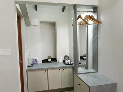 a kitchen with a counter with a mirror in it at Green Planet Resort in Mattanūr