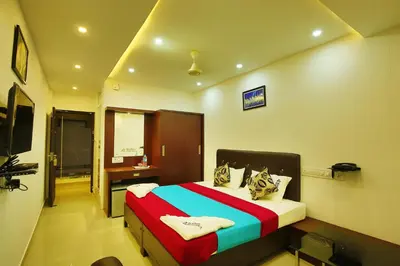 a bedroom with a large bed in a room at karibu Residency in Malappuram
