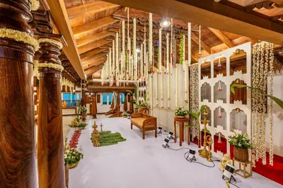 a large room with skis on the wall at Sterling Darshan Guruvayur in Guruvāyūr