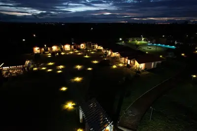 a group of lights in a field at night at vihangama Home Stay in Chāmundi