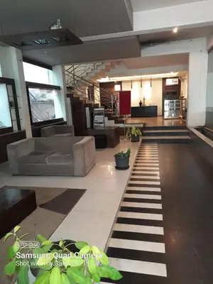 a living room with a couch and a table at Sayoojyam Residency in Palakkad