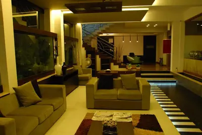 a living room with two couches and a table at Sayoojyam Residency in Palakkad