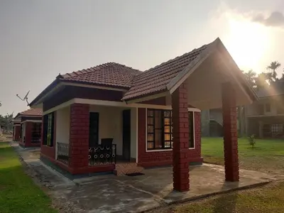 a small house with a pitched roof at Dubare Inn Coorg in Madikeri