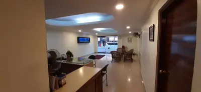 a living room with a blue light on the ceiling at MADAPARAMBIL RESIDENCY in Alwaye