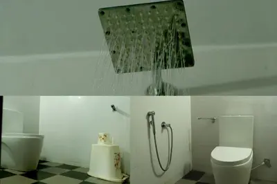 a bathroom with a shower and a toilet at NARMADA HOMESTAY Ganga in Perintalmanna