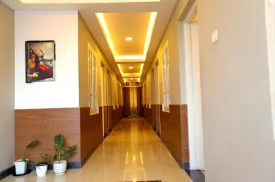a hallway in a building with a hallway at SAPPHIRE INN in Nedumbassery