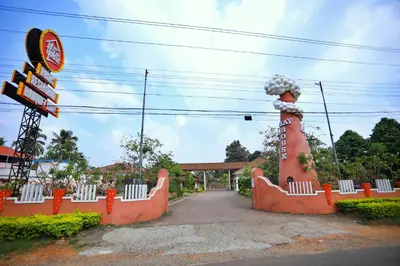 a road with a sign and a monument at Clay House in Trichūr