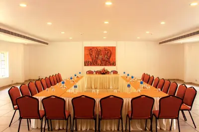 a large conference room with a long table and chairs at Clay House in Trichūr