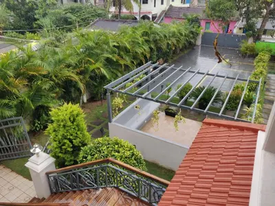 an overhead view of a building with trees and plants at Elegant holiday homes Coorg in Madikeri
