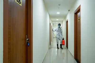a man standing in a hallway in a hospital at Nexstay Treats Inn in Kozhikode