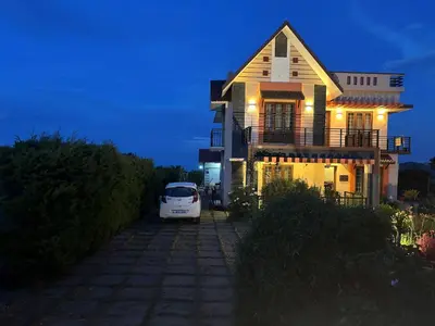 a white car parked in front of a house at Casa Felicia-Adding happy moments to your diary in Ooty