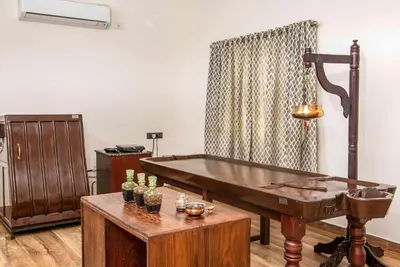 a ping pong table in a room with a ping at StayVista at Springhills Villa & Ayurvedic Spa in Cochin