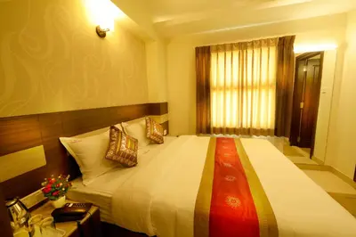 a bedroom with a large bed with pillows on it at HOTEL THE FORTUNE in Coimbatore