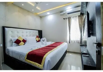 a bedroom with a large bed in a room at SR BOUTIQUEE STAY in Coimbatore