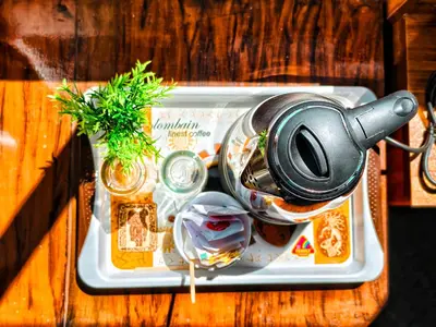 a tray with a tea kettle on top of it at CARMEL HOME STAY in Munnar