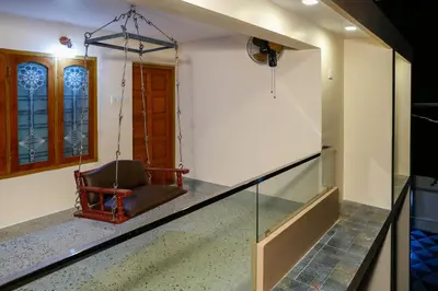 a swing in the hallway of a house at Belljem Homes -your own private resort -3 BHK FF in Trichūr