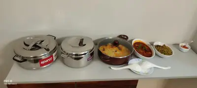 a kitchen counter with several pots and pans on it at the motville - Serene Family Retreat & Private Pool in Pulpally
