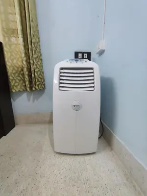 a heater sitting on the floor in a room at Kavitha House Homestay in Mysore