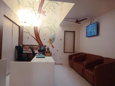 a living room with a couch and a table at HOTEL VINTAGE CASTLE in Coimbatore
