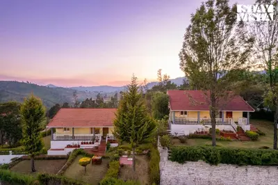 an aerial view of a house with a yard at StayVista at Zolas Retreat 2BHK Pet Friendly and Breakfast Included in Coonoor