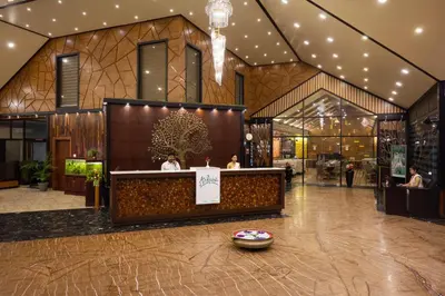 a store with a counter in the middle of a building at Au Revoir Wellness Resort, Malampuzha in Palakkad