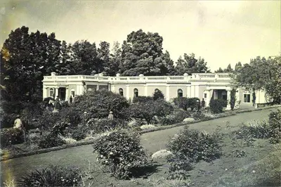 an old photo of a large white house at Savoy - IHCL SeleQtions in Ooty