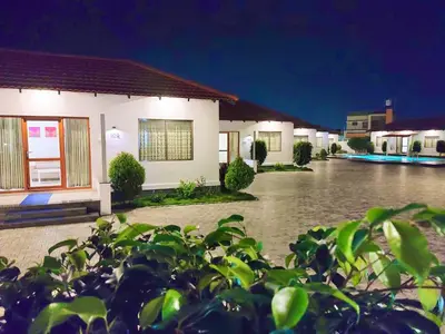 a house in the middle of a flooded street at MALLI resort in Dhārāpuram