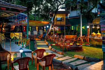 a group of chairs and tables in a yard at Belljem Homes -your own private resort -1 BHK FF in Trichūr