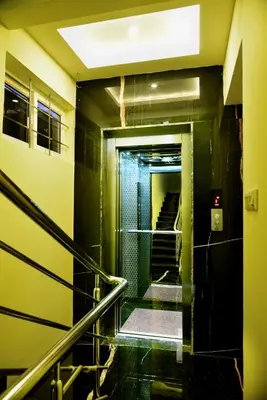 a hallway with stairs in a building at Vismaya Comforts in Mysore