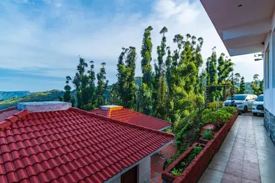 a red roofed house with a red roof at Warmth Hill Crest in Kodaikānāl