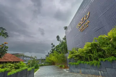 a building with a sign on the side of it at Saptha Resort and Spa in Sultan Bathery