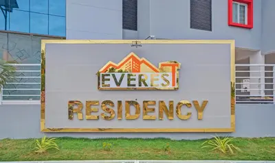 a sign on a building with the words everres residency at Treebo Everest Residency Tidel Park, 15 Mins From Coimbatore International Airport in Coimbatore