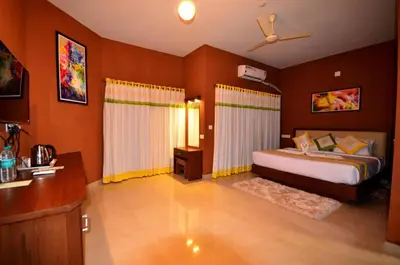 a bedroom with a bed in a room at LakeRose Wayanad Resort - Lake view in Kalpetta