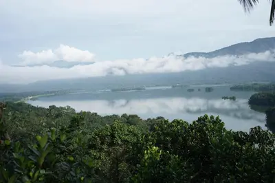 a view of a lake with clouds in the water at Casa Lucio Resorts in Mannārakkāt