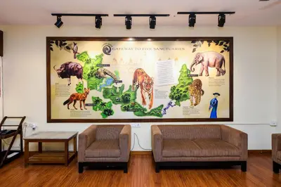 a large poster of dinosaurs on the wall of a room at SAFARI QUEST in Mysore