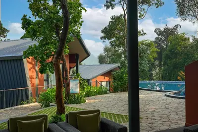 a view of the pool from the lobby of a resort at Vyna Hillock Resort in Vythiri