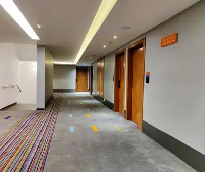 an empty hallway of an office building with a hallway at Zone Connect by The Park Coimbatore in Coimbatore