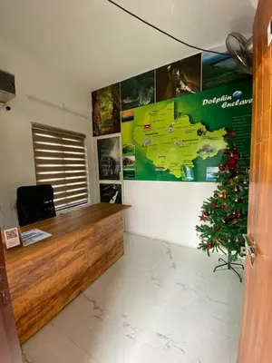 an office with a desk with a christmas tree in it at DOLPHIN ENCLAVE SERVICE STUDIO APARTMENTS in Kalpetta