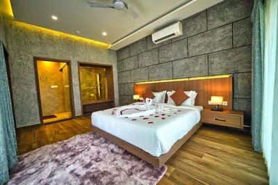 a bedroom with a large bed in a room at Jungle Bay Resorts & Spa in Wayanad