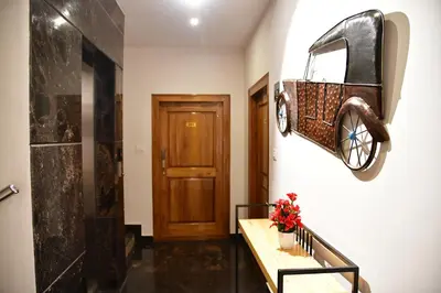 a bathroom with a bike hanging on the wall at Xcel Luxury Hotel Apartments-Home Living Redefined in Mysore
