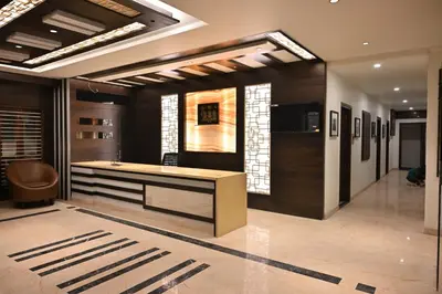 a kitchen with a large island in a room at Mysore Royale in Mysore