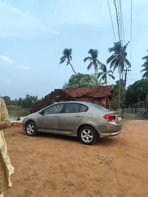 a silver car parked in front of a house at NARAYANALAYAM-Vintage Retreat-Homestay & Rest'Inn in Kannur